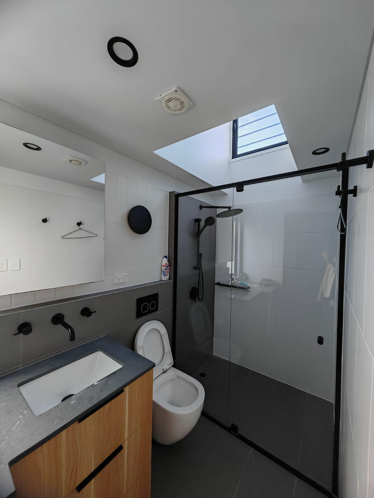 Waterproofing modular buildings: finished tiled walk-in shower and graded wet-area floor in a completed EcoPrestige steel-framed modular unit